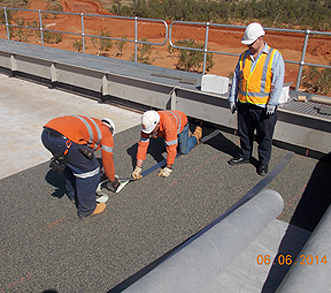 Reinforced Projex SBM Tape being applied over the joints of the Sub Ballast Mats Geotextile fabric is then laid over the Sub ballast mat