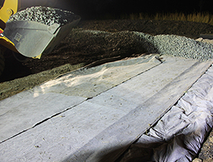 Suitable layer of ballast being applied